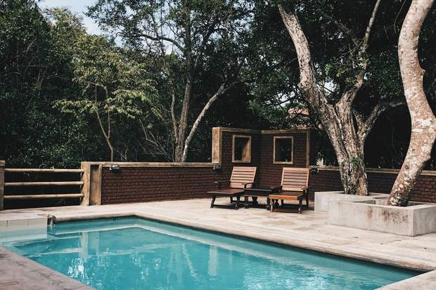Poolside deck and lounge chairs, Property photography